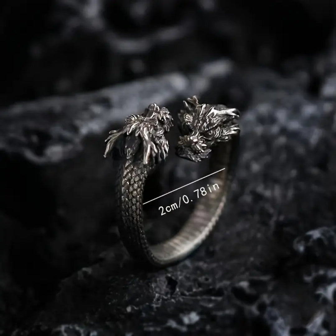 A close-up of a vintage double dragon head ring, showcasing intricate dragon designs and a bold, edgy style perfect for men's punk or hip-hop fashion.